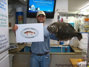 Parker Michael, from Newport, NC, caught this 10 lb. flounder at the port wall on a Carolina-rigged live bait. Photo courtesy of Chasin' Tails Outdoors.