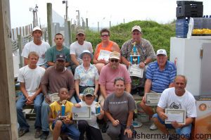 The winners of the Mike Martin Pier Tournament celebrate their success Sunday afternoon following the awards ceremony.