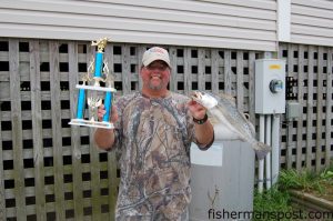 Tony Lane, of Chinquapin, NC, with his trophy and the 3.17 lb. speckled trout that earned him $1000 in the 4th annual Mike Martin Pier Tournament, held last weekend from Surf City Pier.