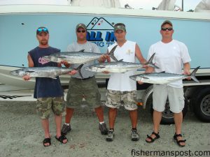 Jason Hacker, Mark Schroeder, Lex Orians, and Bill Knapp, from Sycamore, OH, with kings caught while fishing with Capts. Andy and Adam Powell of All In Charters out of Surf City. The fish fell for live baits fished behind Blue Water Candy skirts.