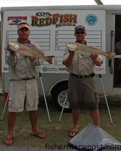 Capts. Mike Taylor and Jeff Cronk, of team NCCharterfishing.com, with the two red drum weighing 14.26 lbs. that earned them second place based on time in the second CCFA Redfish Series event. The reds were caught on a Swansboro-area flat. Photo courtesy of Lew McCloud.