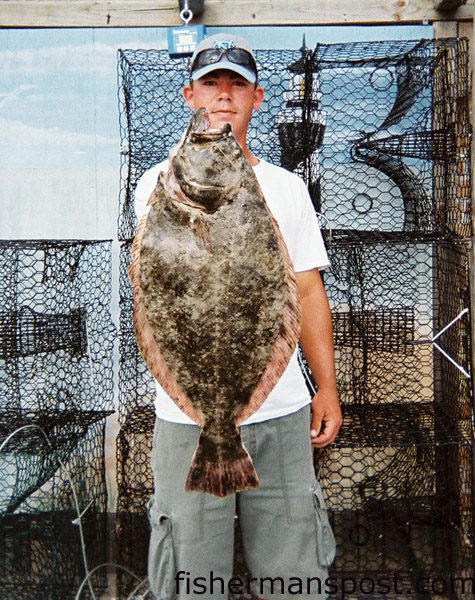 Adam Moore with a huge (especially for July) 11 lb. flounder he caught on a live bait in the Cape Fear River. Weighed in at Island Tackle and Hardware.