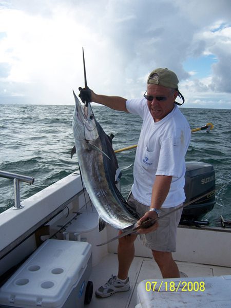 Mel Miller prepares to release a sailfish he caught just 1/2 mile off the Carolina Beach Inlet sea buoy while fishing with Alan Stout aboard the “Fun $eeker.”