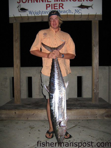 Chuck DesJardins with the 41.2 lb. king mackerel that broke the Johnnie Mercers Pier record. He caught the smoker king on a live bluefish fished on a king rig from the end of the pier.