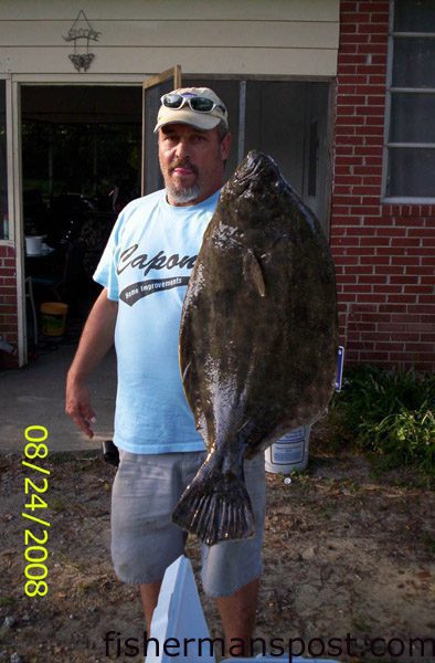 Steve Rochelle, from Jacksonville, NC, with a 12 lb. flounder that struck a live pinfish in Bear Creek behind Brown’s Island.