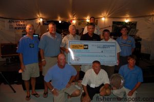 Beaufort Offshore Celebrity Classic President Dan Webb and Tournament Director Tyler Bowery present the first place prize in the blue water category to Capts. Paul Spencer and Chuck Lindner and the crew of the "Honey Hush," who released six sailfish over the event's two days of fishing.