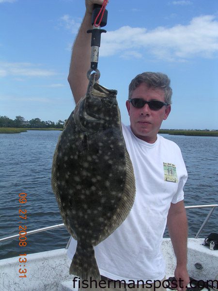 Jim Holtvoight with an 8 lb. 5 oz. flounder he caught on a Carolina-rigged finger mullet near Figure Eight Island. Weighed in at Tex’s Tackle.