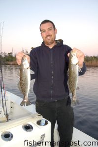 Max Gaspeny with a pair of speckled trout that struck a green curlytail grub while on a trout tagging mission with Capt. Ricky Kellum, of Speckled Specialsit Charters, and Tim Ellis, from N.C. State University.