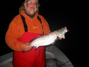 Ted Page, from Harkers Island, with a trout caught in 3' of water near the Cape Lookout rock jetty on a MirrOlure. He was fishing with Capt. Charles Brown of Old Core Sound Guide Service.