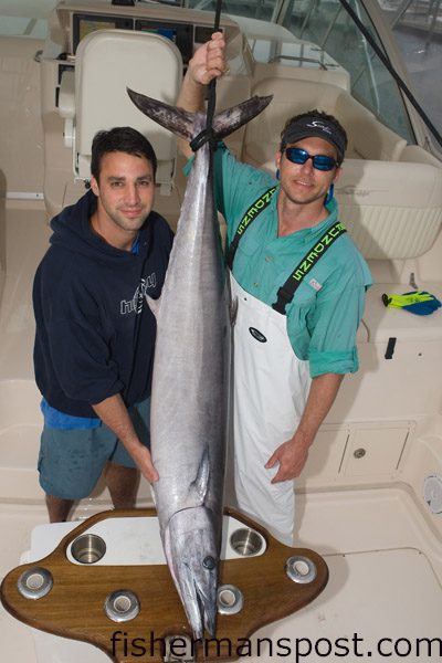 Jimmy O’Connor, of Carolina Beach, and Mike Kenney, of Wilmington, with a 68 lb. wahoo they hooked just inside the 100 fathom line south of the Steeples while fishing aboard the “Theseus.” The big ‘hoo fell for a ballyhoo beneath a red/black Ilander Tracker.