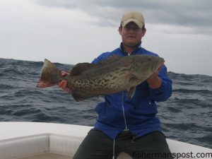 Mate Jacky Dufour with a 30" gag grouper that ate a chunk of Boston mackerel on the bottom in 100' around 25 miles off Beaufort Inlet. He was fishing with Capt. Ken Mullen of Swell Rider Sportfishing.