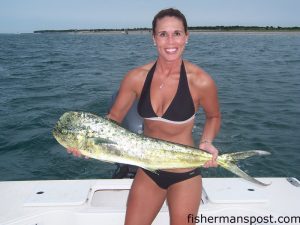 Michelle Grogan, of Burlington, NC, with a dolphin that fell for a rigged ballyhoo 12 miles off Atlantic Beach while she was fishing with Capt. Mark Grogan.