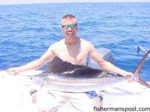 Paul Dunwell, from Shallotte, NC, with his first sailfish. The sail fell for a ballyhoo behind a pink Kingbuster near the Blackjack Hole.