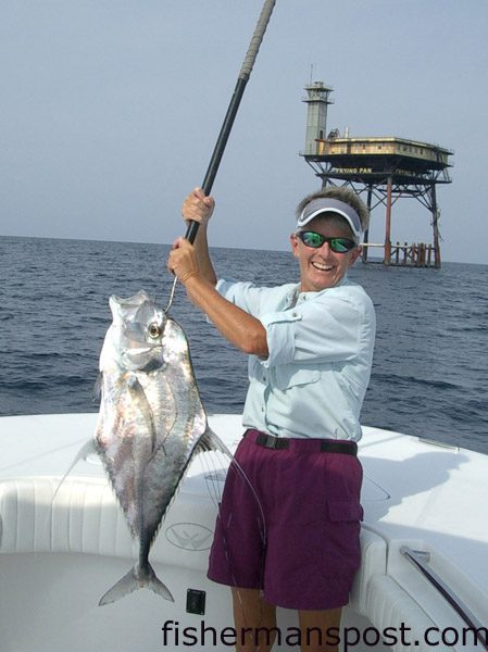 Laura Hendrick with an African pompano she hooked while fishing near Frying Pan Tower on a private guide trip with Capt. Rick Croson of Living Waters Guide Service.