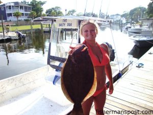 Ashley McDavid with her first citation flounder. She caught the 5.2 lb. flattie on a live bait in Snow's Cut.