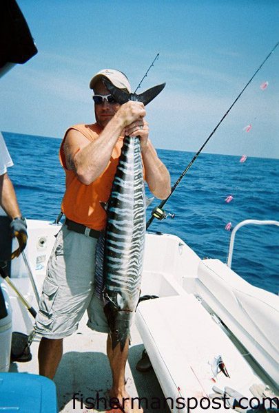 Scott Aumon with a 28 lb. wahoo he hooked 10 miles south of the Blackjack Hole using a purple and black plug. He was fishing aboard his boat, the "West End Girl," with Capt. Josh Baxley of Tuna Tamer Charters.