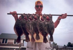 Chuck Andrews, from Lucay, VA, with a stringer of flounder caught near Oak Island using live peanut pogies. He was fishing with Capt. Greer Hughes of Cool Runnings Charters.