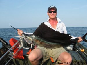 Benjamin Bruton, of Wilmington, NC, with a sailfish he caught and released on a skirted cigar minnow 8 miles off Carolina Beach Inlet. He was fishing with Lowell Mason on the 16' jon boat "Sarah's Worry."