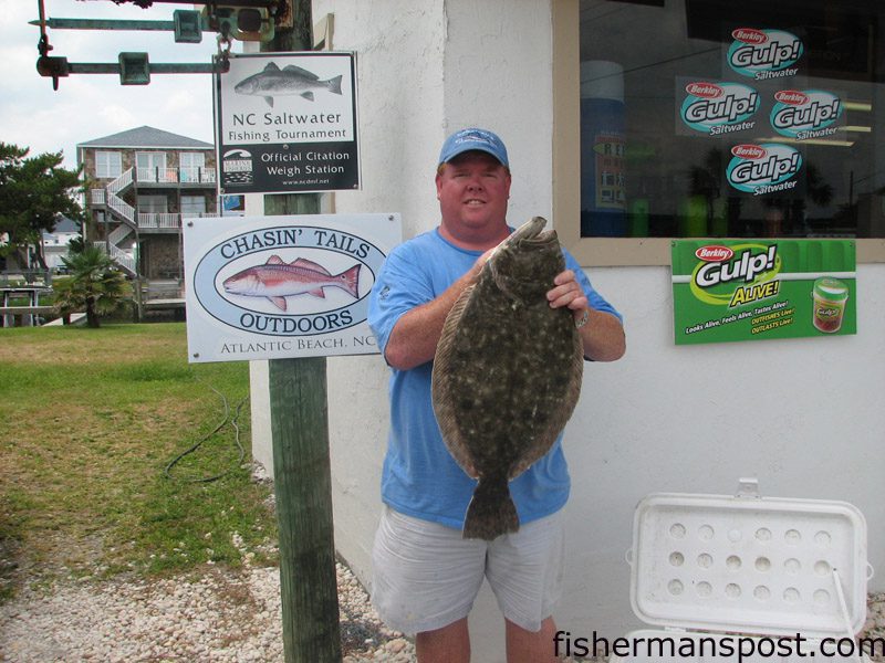 Carl Malpass, Jr., of Raleigh, with an 11.34 lb. flounder he hooked on a live bait at the Morehead port wall. Weighed in at Chasin’ Tails Outdoors.