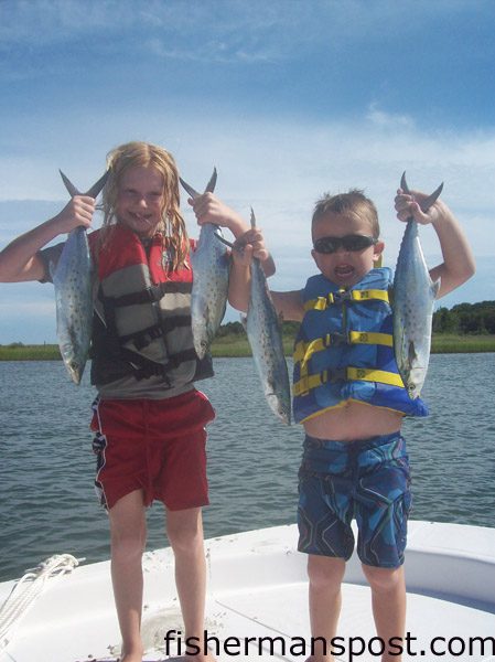 Lauren and Jarrett Caviness, of Hampstead, NC, with spanish mackerel they hooked on gold Clarkspoons behind planers off Lea Island.