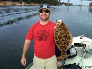 Trey Kilpatrick with a 22" flounder that fell for a Carolina-rigged cut bait in Snow's Cut while he was fishing with his father on the "Floundertrap."