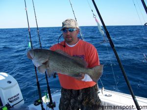 Brad Ricker with his first gag grouper. He hooked the fish on a live cigar minnow at the Horseshoe while fishing with Capt. Bill Zeron on the "Bottom Line."