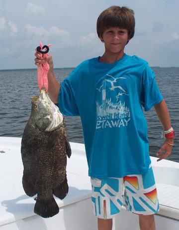 Justin Blackburn, of Wilmington, with an 11.6 lb. tripletail that was hooked on a sight-cast mud minnow near a crab trap float in the Cape Fear River. He was fishing with Capt. Jeff Wolfe of Seahawk Inshore Charters.