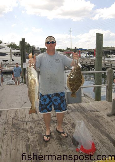 Capt. Brandon Dean, of Southport, with a 7.12 lb. red drum and a 3.16 lb. flounder that earned first place red drum and first place aggregate in the Wrightsville Beach Inshore Challenge. The red bit a live menhaden at some bottom structure just off Kure Beach while he was fishing with his father Larry.