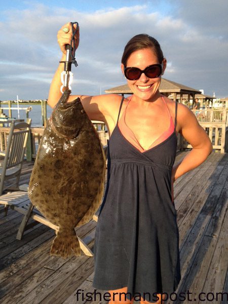 Kristy David, of Matthews, NC, with a 27.5″ flounder that bit a live finger mullet under a dock in Lee’s Cut at Wrightsville Beach.