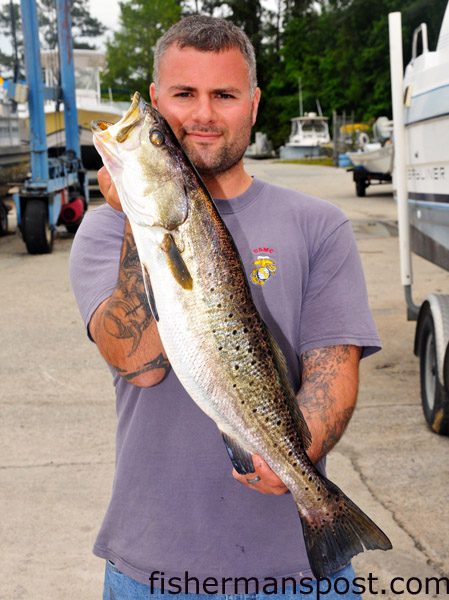 Kenny Marmelo, of Hubert, NC, with a citation 5 lb., 12 oz. speckled trout that he hooked in the New River near dowtown Jacksonville on a Rapala plug. Weighed in at Tideline Marine.