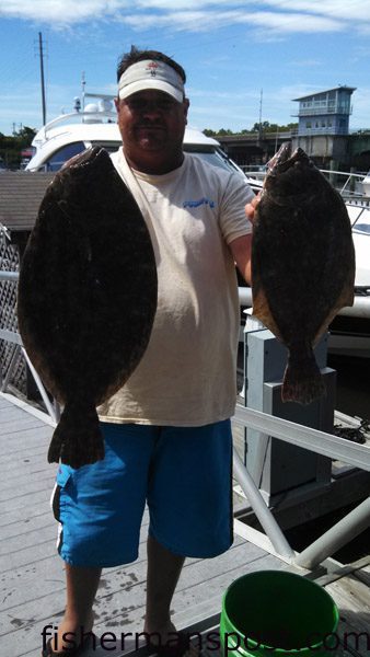 John Ballantine, of Southport, with a pair of flounder including the 5.23 lb. fish that earned he, Ricky Evans, and Eric McMahan first place in the Wrightsville Beach Inshore Challenge. The big fish bit a live croaker in a creek near Southport.