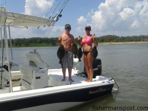 Joey and Deanna Matthews with four of 17 flounder they caught while fishing Yaupon Reef.