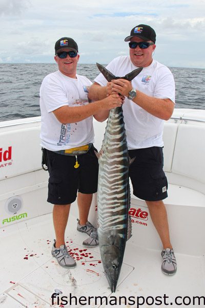 Crockett and Joshua Henderson, of the Liquid Fire Fishing Team, with a 50.05 lb. wahoo that bit a live menhaden east of Cape Lookout Shoals.