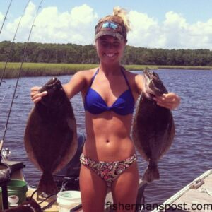 Jamie Renn, of Southport, with a pair of flounder that bit live finger mullet near Southport while she was fishing with her boyfriend.