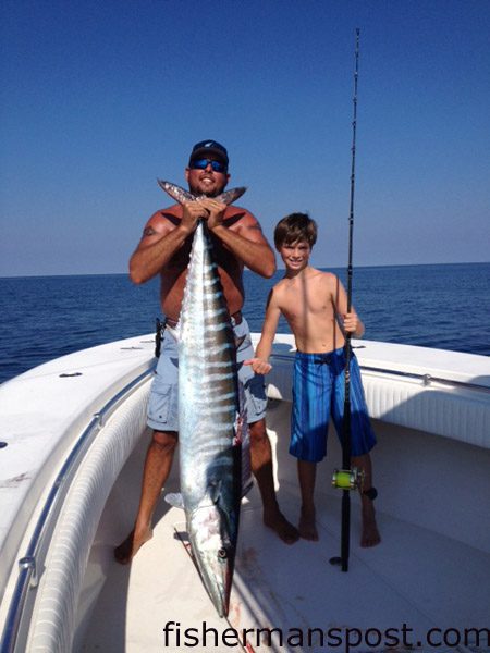 Henry Tillett and Henry Tillett, Jr. with a 76 lb. wahoo that struck a live menhaden at 30 Minute Rock while they were fishing with Wendy Tillett on the “Windy Conditions” out of Beaufort.