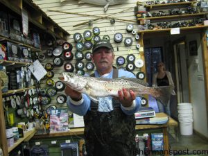 Lee Throckmorton with a 4.68 lb. speckled trout that he hooked on a TT MirrOlure in the Emerald Isle surf. Weighed in at The Reel Outdoors.