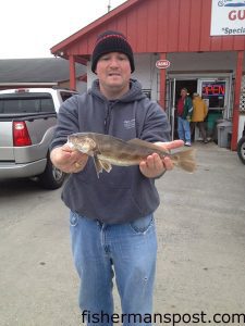 Tim Sawyer, of Pleasant Garden, NC, with a 1.6 lb. sea mullet he hooked near Southport while fishing with Steve Allred on the "Top Pair Top Kicker."