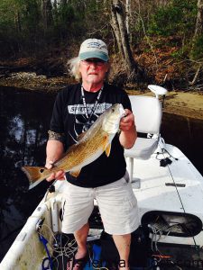 Richard Walton with a 25" red drum he hooked on a piece of shrimp pinned to a jighead while fishing a Sneads Ferry creek. 