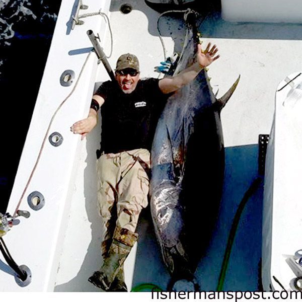 Kevin Eller and a 96″, 308 lb. dressed weight bluefin tuna that attacked a skirted ballyhoo off Oregon Inlet while he was trolling with Capt. Lee Collins on the “Strike ‘Em” out of Oregon Inlet Fishing Center.