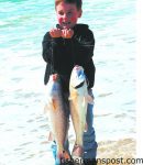 Logan Futch with a double header of puppy drum he hooked near Cape Point. Photo courtesy of TW's Tackle.