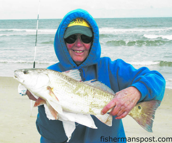 Betty Wright, of TW’s Tackle, with a puppy drum she hooked on cut shrimp near Oregon Inlet while fishing with her daughter and son-in-law.