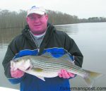 Stacy Strickland, from Goldsboro, NC, with a striped bass he hooked on a D.O.A. CAL jerkbait. He was fishing the Neuse River near New Bern with Capt. Gary Dubiel of Spec Fever Guide Service.