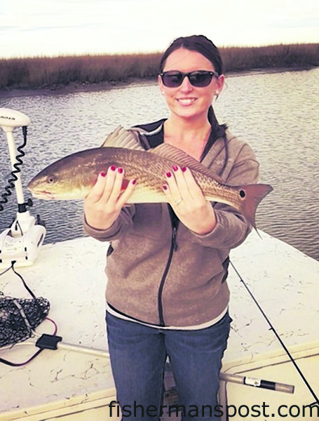 Jenna Raymond with a 21″ red drum she hooked in a creek off the lower Cape Fear River.