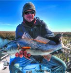 Clarence Whitley, of Greenville, NC, with his first red drum, hooked on a Betts Halo Shad near Bald Head Island while he was fishing with Scott Hampton.