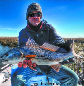 Clarence Whitley, of Greenville, NC, with his first red drum, hooked on a Betts Halo Shad near Bald Head Island while he was fishing with Scott Hampton.