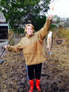 Kelsey Claiborne, of Wilmington, with a puppy drum that bit shrimp under a slip float in a Sneads Ferry creek while she was fishing with Brent Hinson.