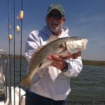 Dale Smith, of Swansboro, with a 27" red drum that bit a white Gulp shrimp near Bear Inlet while he was fishing with Capt. Chris Sewell of Fishead Charter.