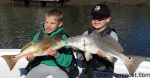 Isaiah Miller and Jake Frick with a pair of red drum that bit blue crab chunks near Ocean Isle Beach while they were fishing with Capt. Jacob Frick of J&J Inshore Charters.