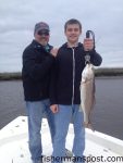 Roy and Alex Itch, of Waxhaw, NC, with a red drum that bit a live mud minnow on a Mission Fishin' jighead while they were fishing a shallow creek near Little River with Capt. Mark Dickson of Shallow Minded Inshore Fishing Charters.