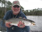 Capt. Gary Dubiel, of Spec Fever Guide Service, with a healthy speckled trout he hooked on a weedless D.O.A. soft plastic in a creek off the lower Neuse River.